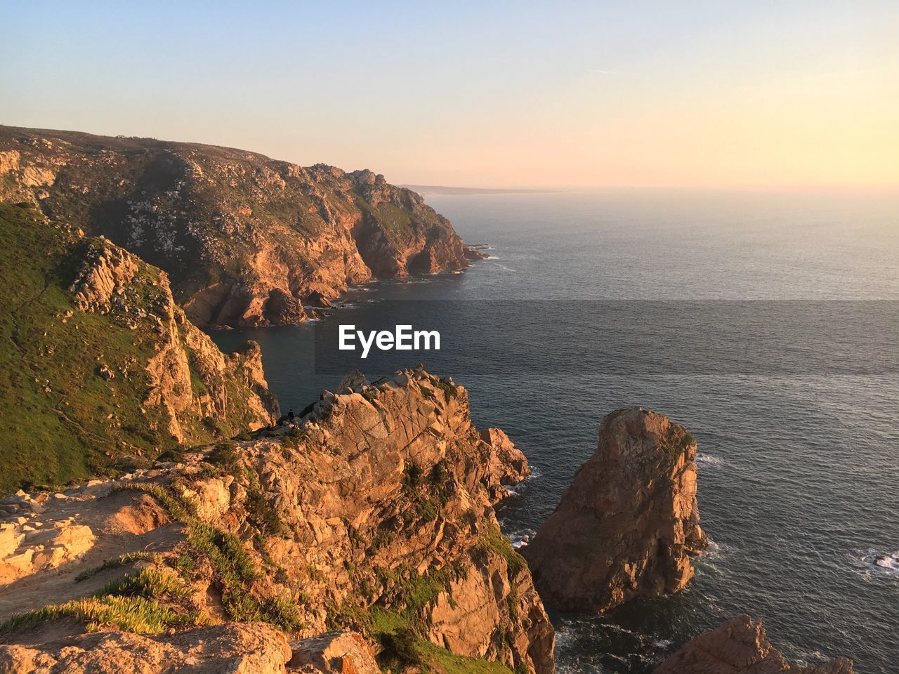 Scenic view of sea against sky during sunset