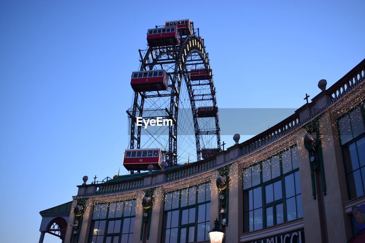 LOW ANGLE VIEW OF CRANE AGAINST CLEAR SKY