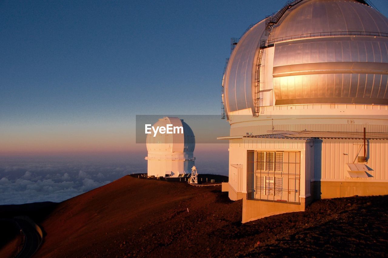 Mauna kea observatory against blue sky at sunset