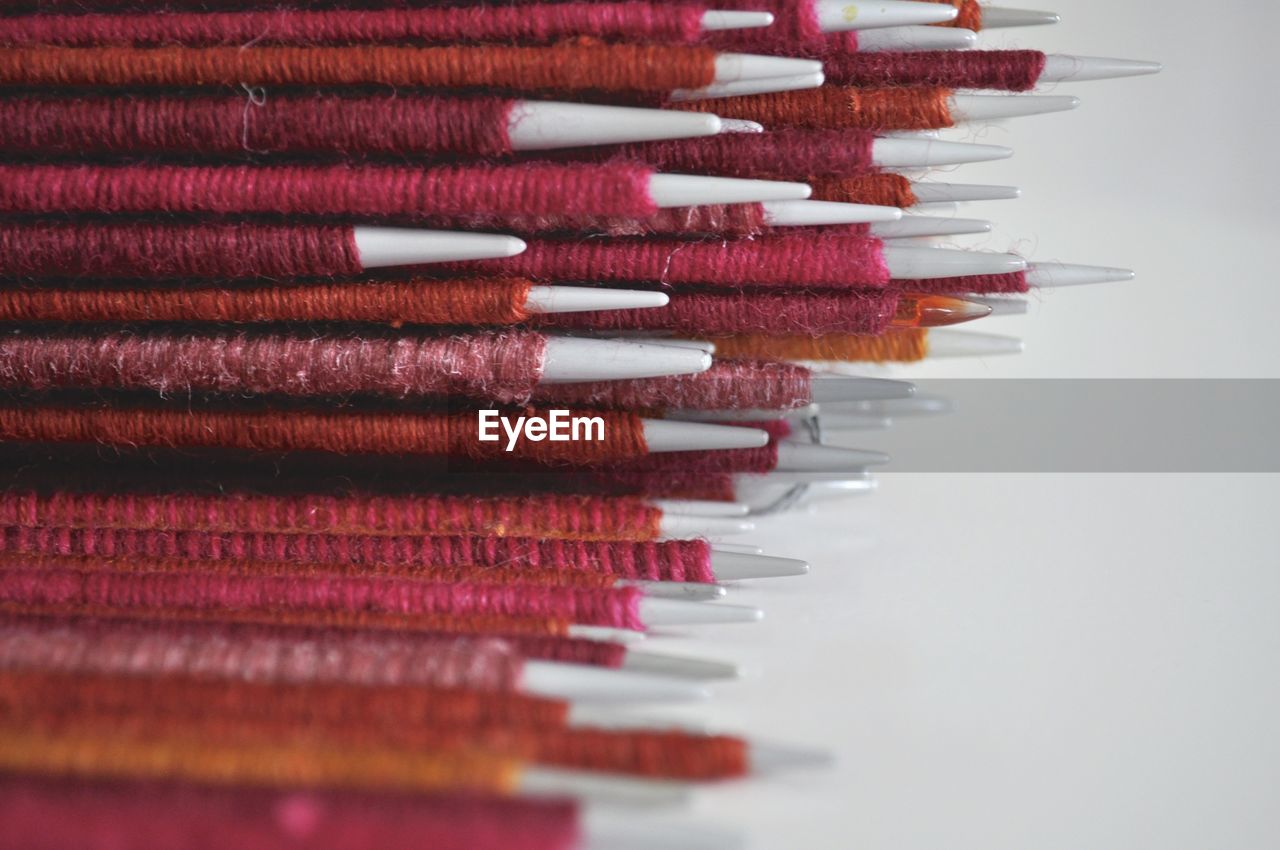 Close-up of knitting needles on table