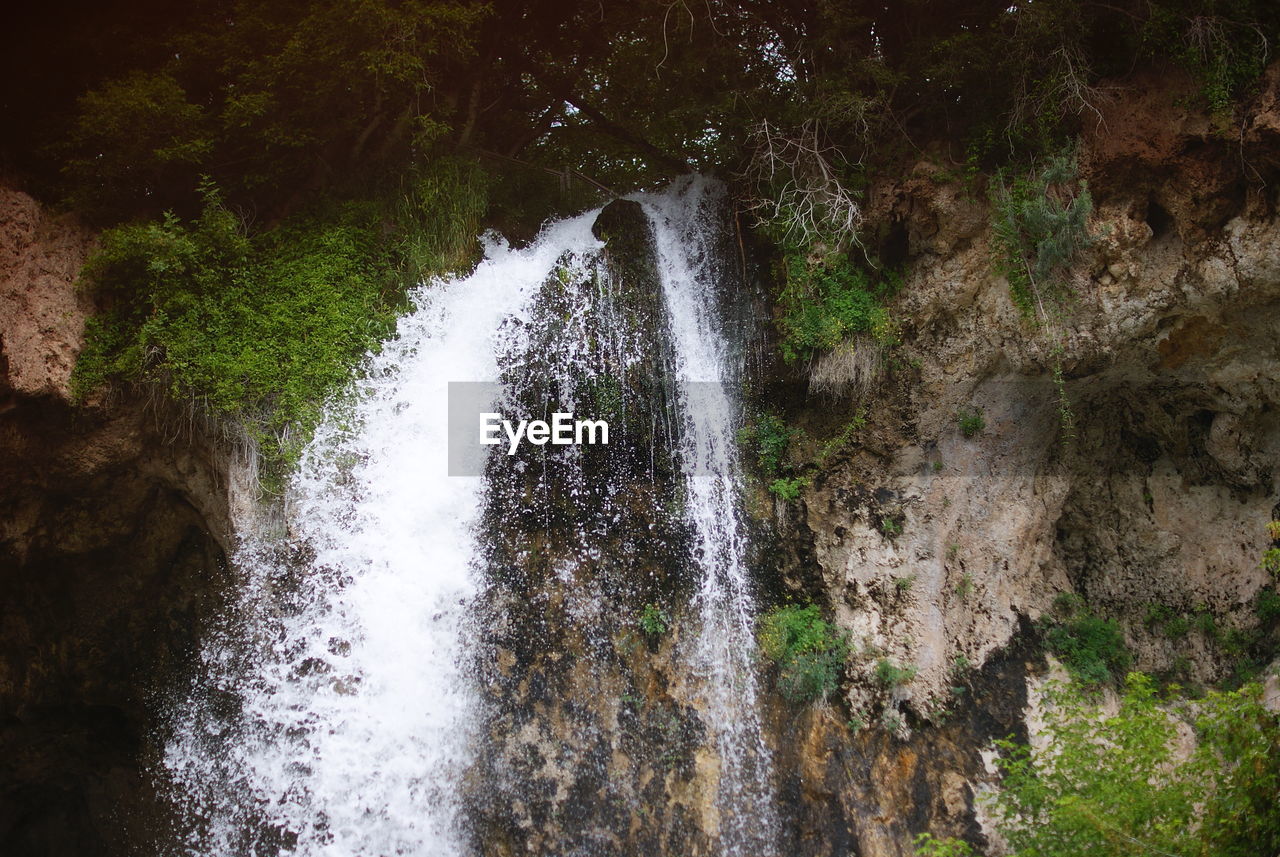 WATER SPLASHING ON ROCKS