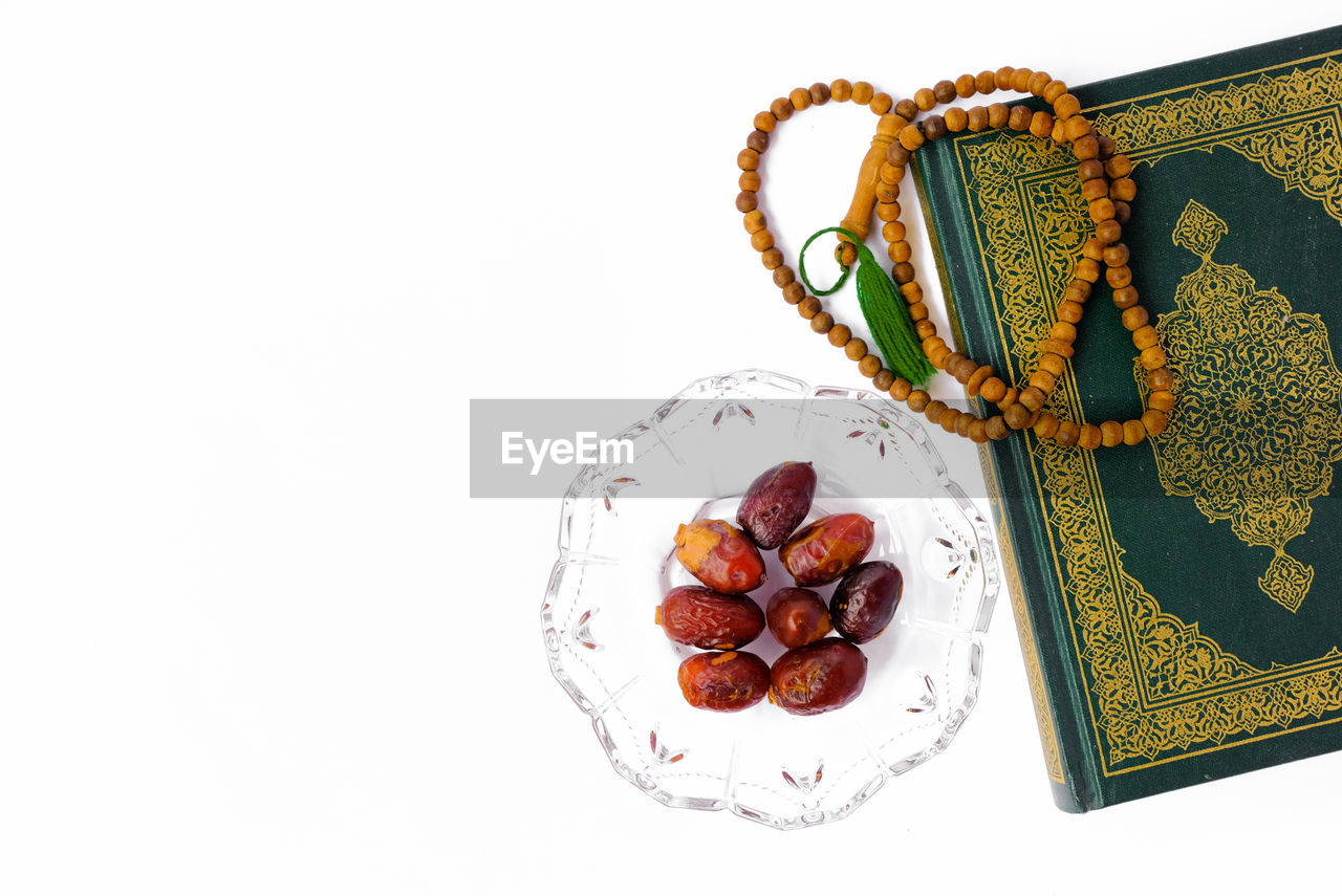 Islamic concept.flat lay composition with muslim prayer beads, al quran on white background.