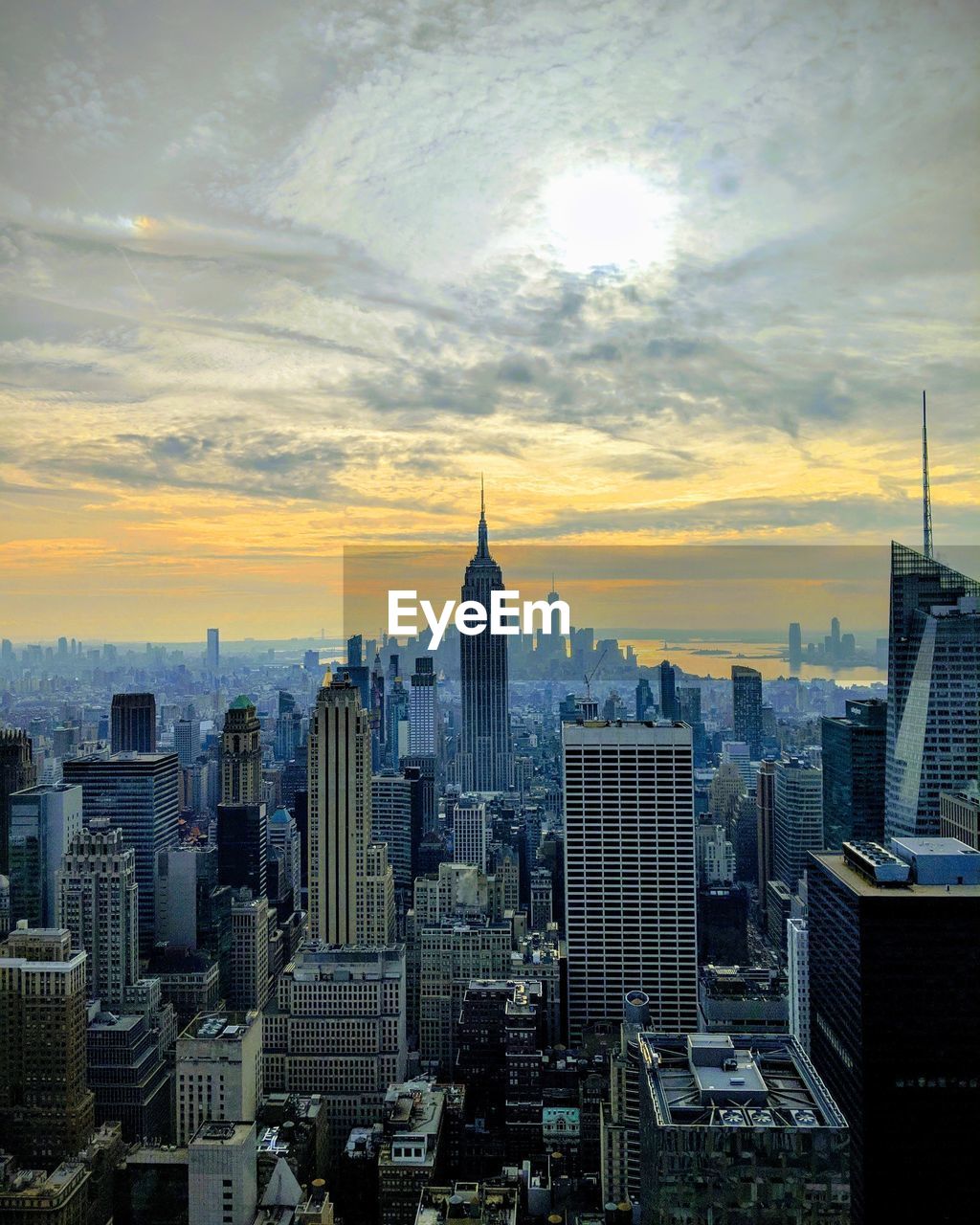 Aerial view of city buildings during sunset