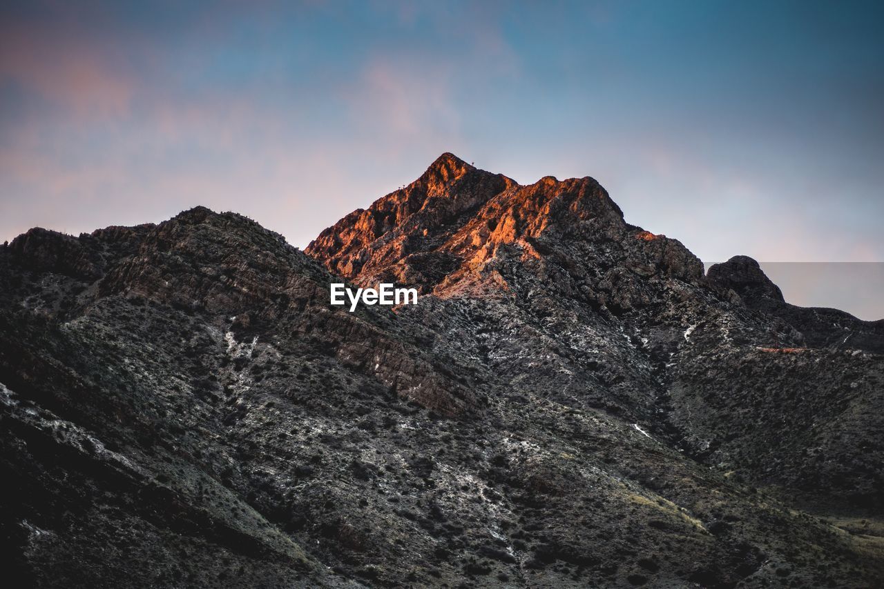 Scenic view of rocky mountains against sky