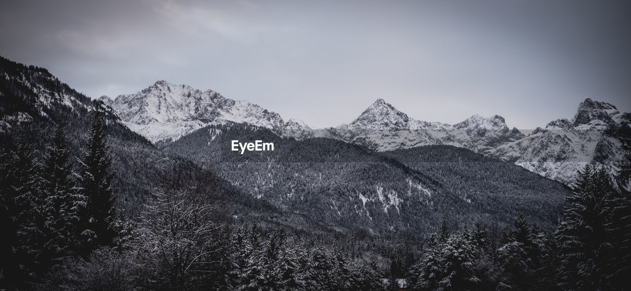 MOUNTAINS AGAINST SKY