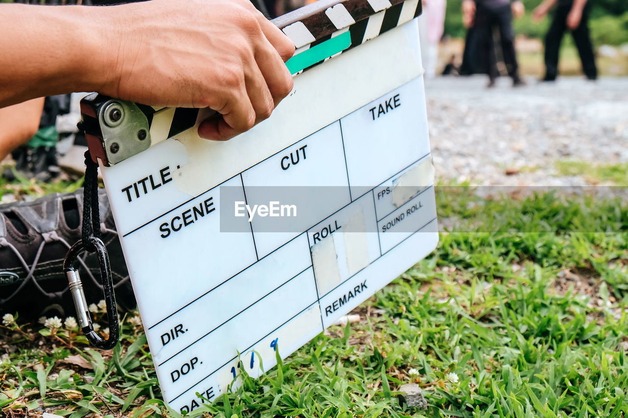 Film slate, close up image of film production crew holding film slate on set