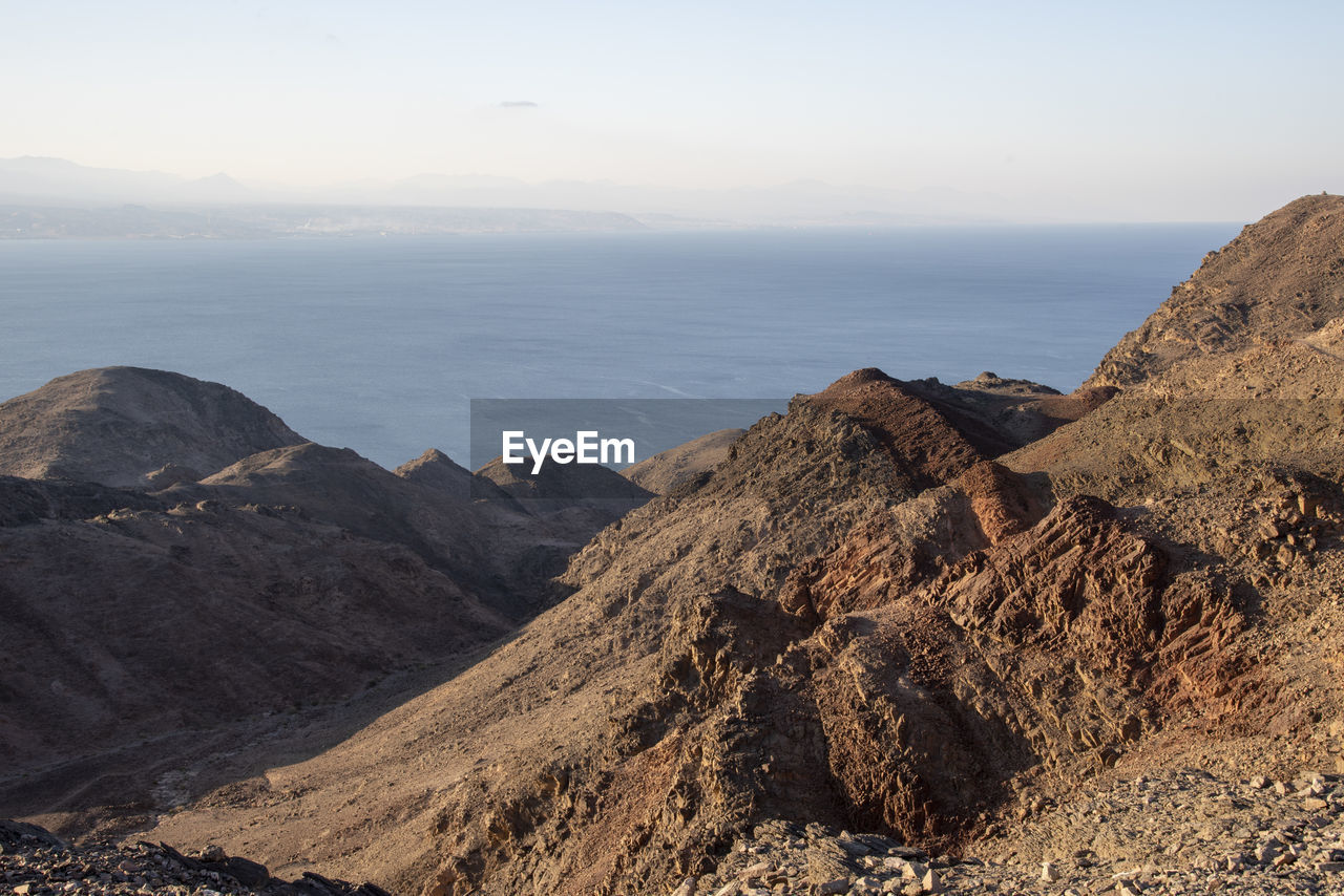 Arid desert mountains against the backdrop of the red sea. shlomo mountain, eilat israel