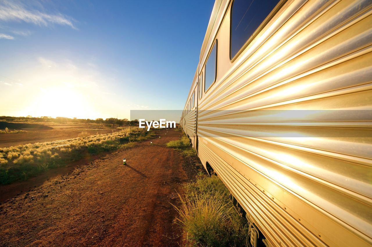 Train by field against sky