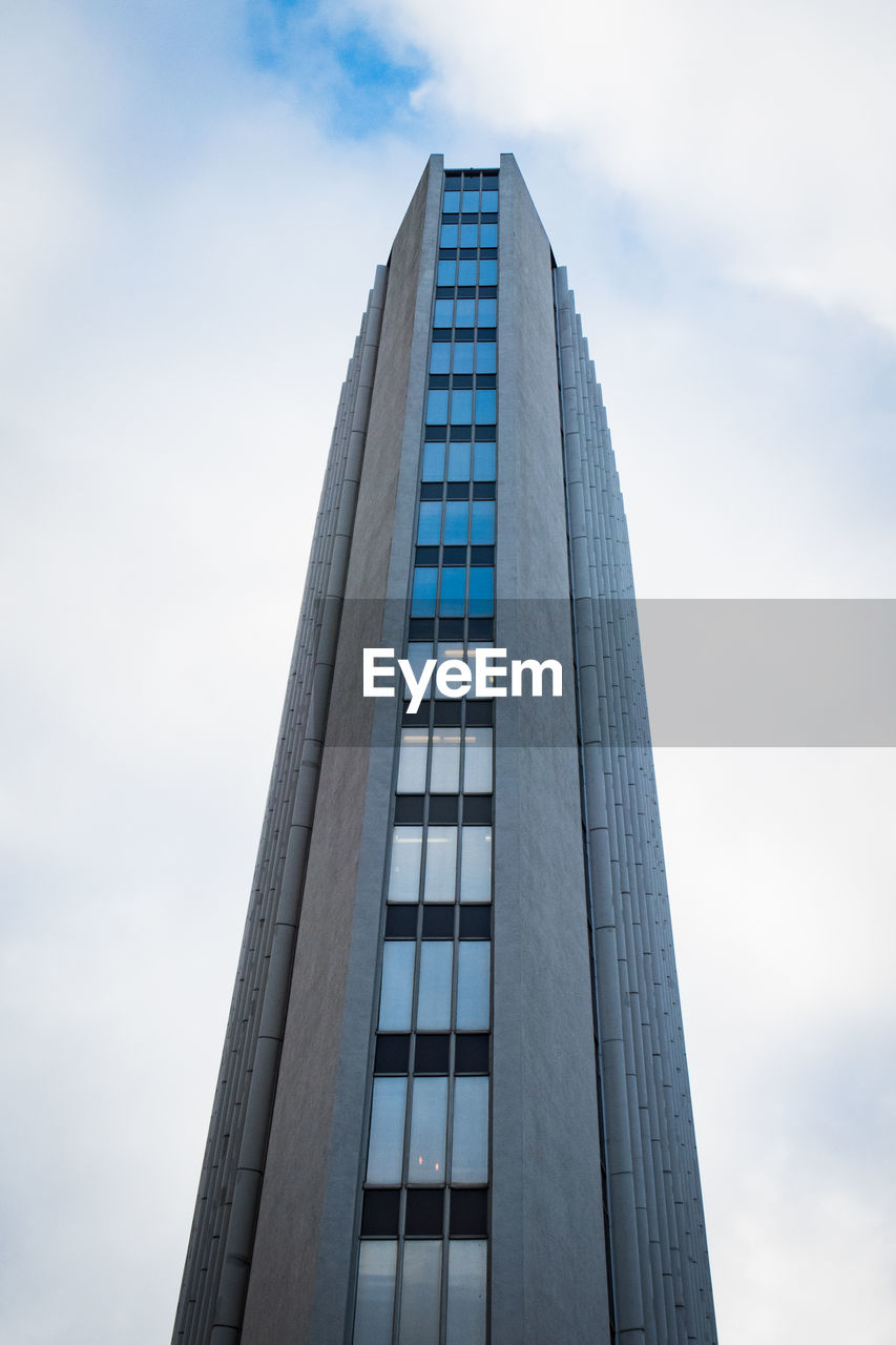 LOW ANGLE VIEW OF OFFICE BUILDING AGAINST SKY