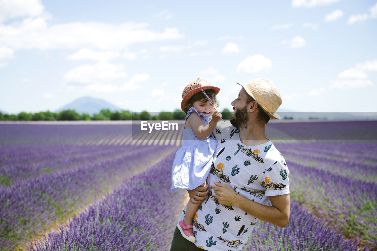 France, provence, valensole plateau, happy father and daughter in lavender fields in the summer