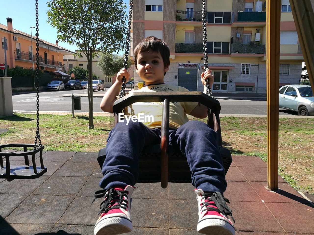 FULL LENGTH OF BOY PLAYING ON PLAYGROUND