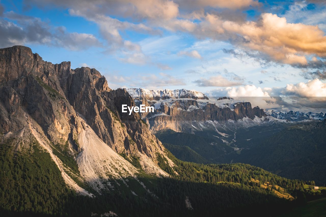 Scenic view of mountains against cloudy sky