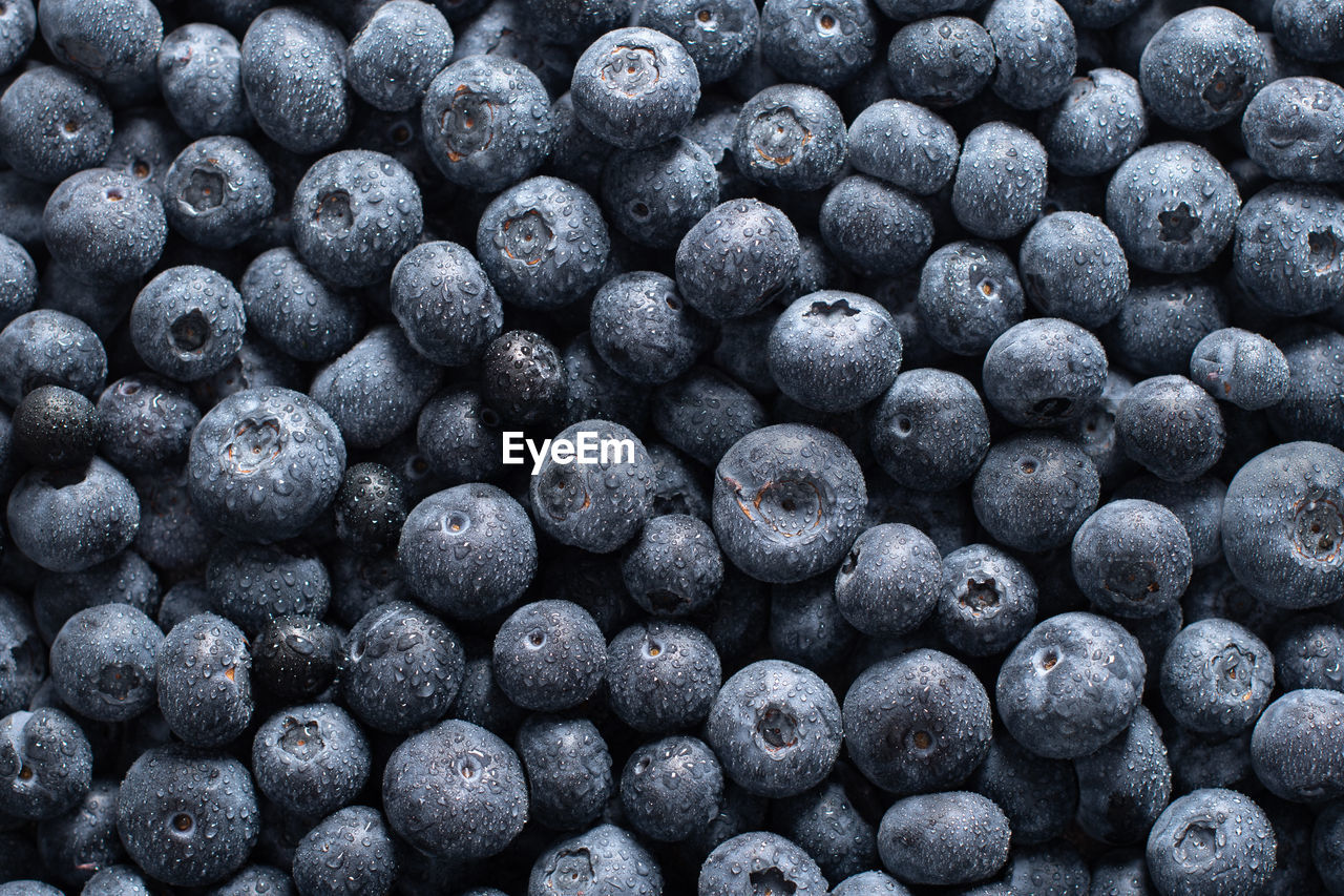 Big box with scattered fresh blueberries, fresh raw food, natural healthy food