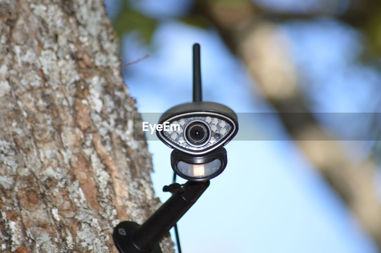 Closeup on a video surveillance camera in the forest