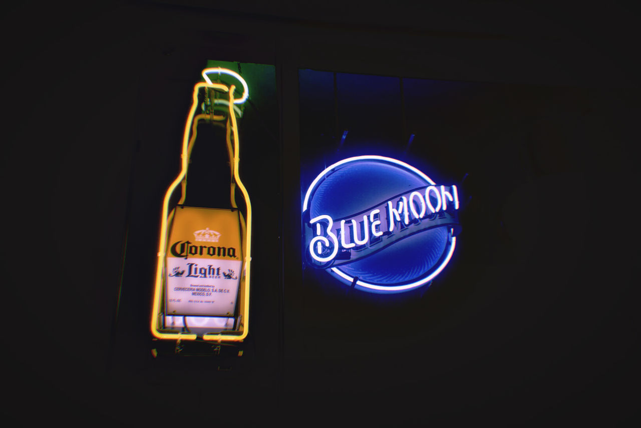 CLOSE-UP OF NEON SIGN ON WALL