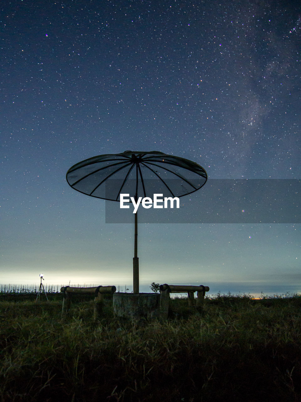 Scenic view of field against sky at night