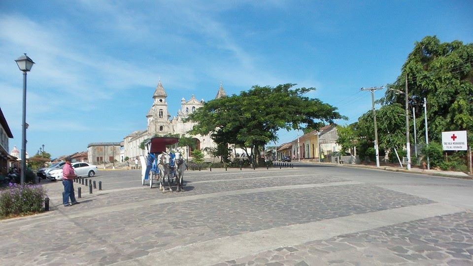 ROAD AMIDST BUILDINGS IN CITY