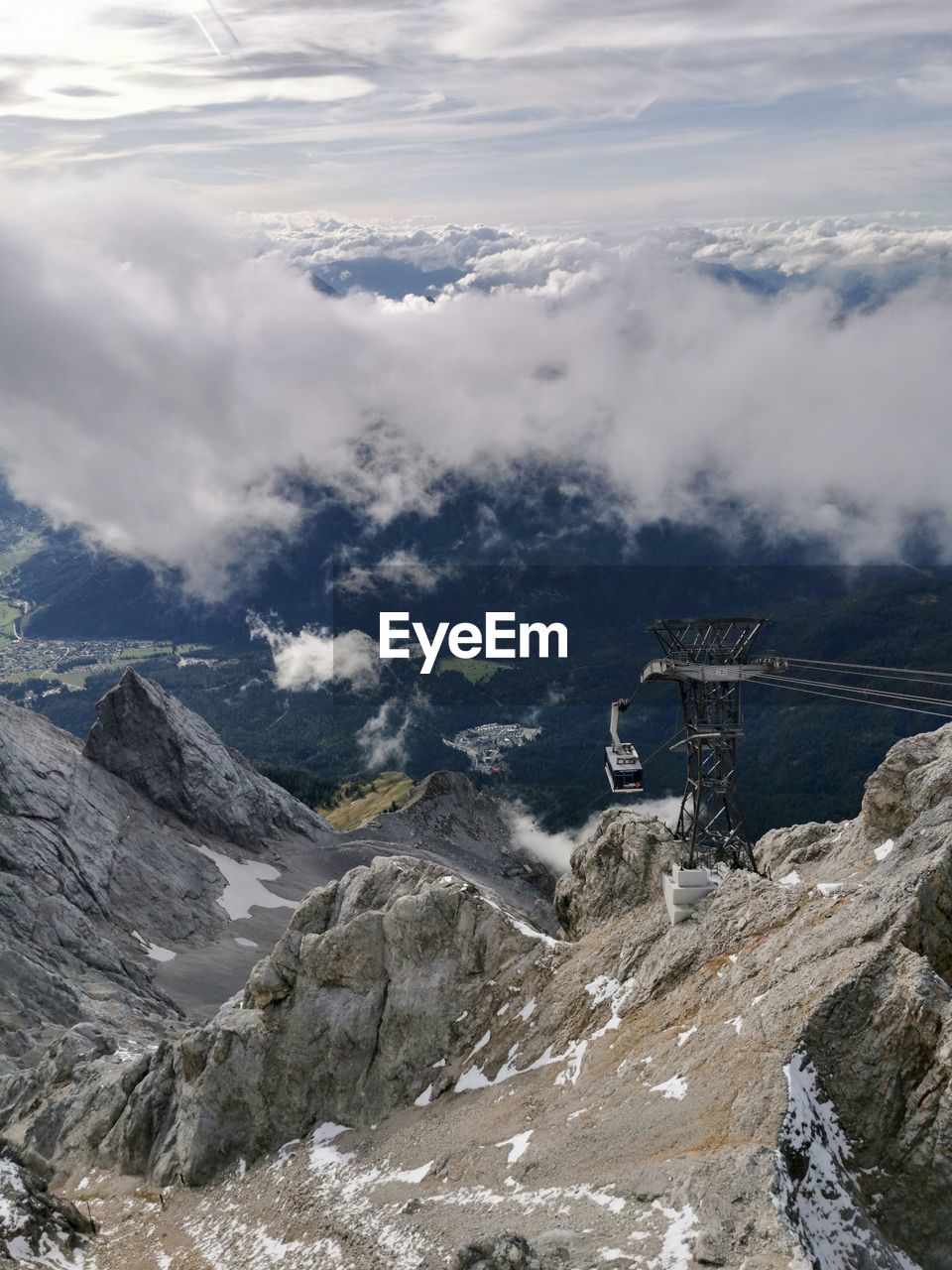 Aerial view of snowcapped mountains against sky