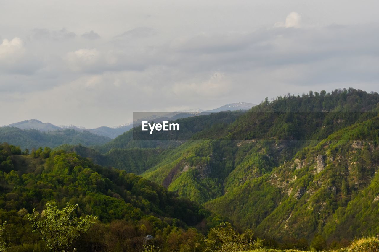 Scenic view of mountains against sky