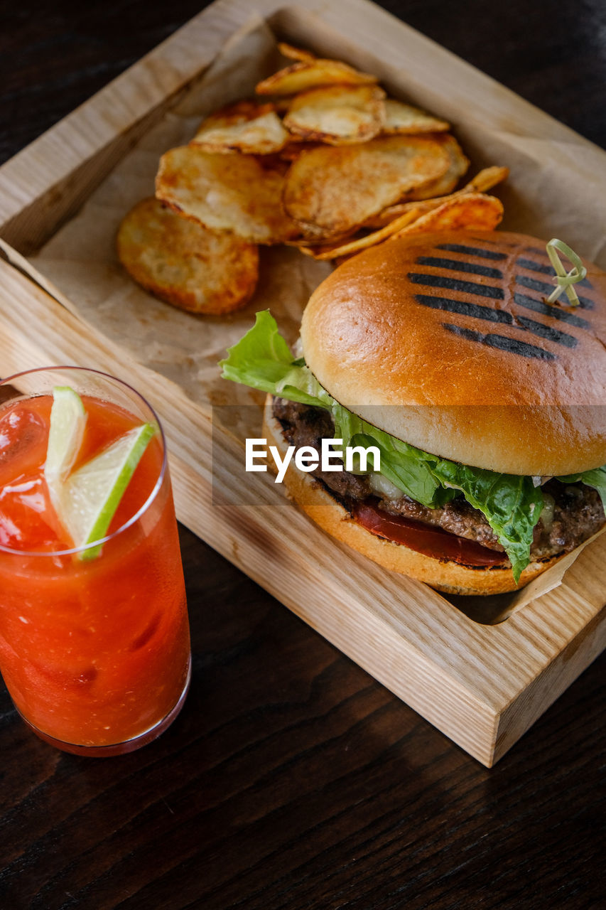 High angle view of breakfast on table burger