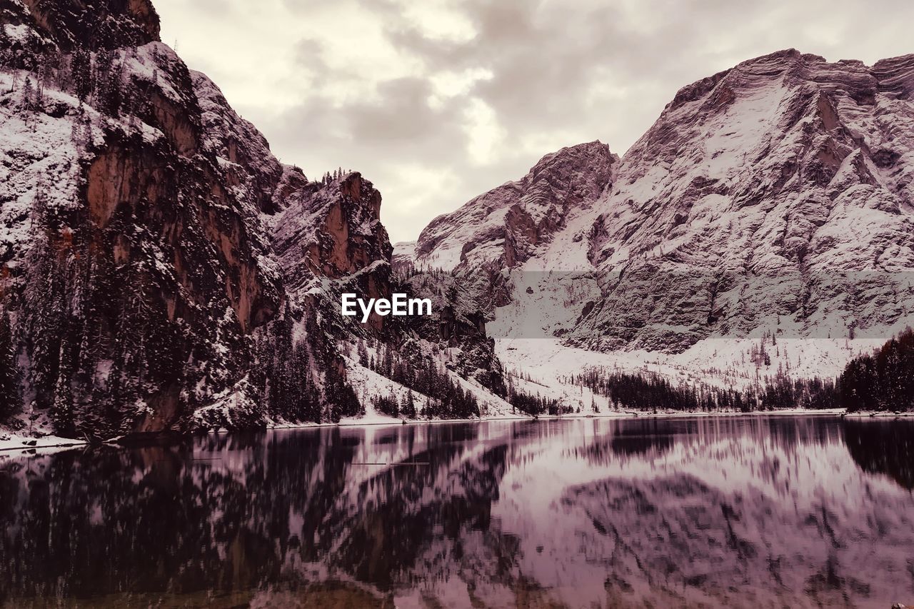 Scenic view of lake and mountains against sky