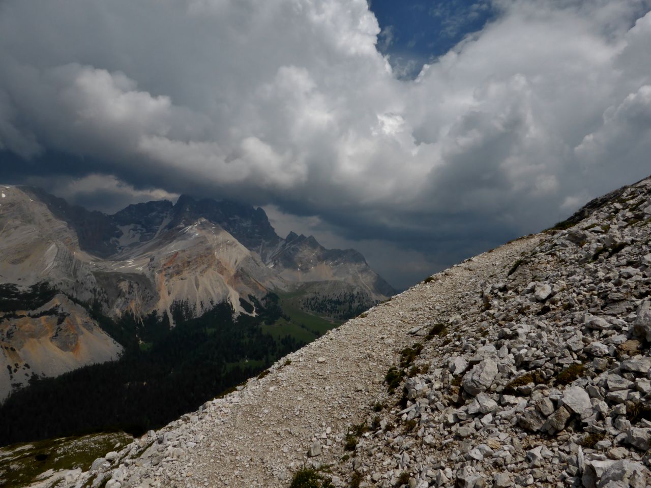 Scenic view of mountains against cloudy sky