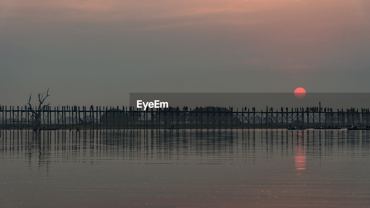 Scenic view of sea against sky at sunset