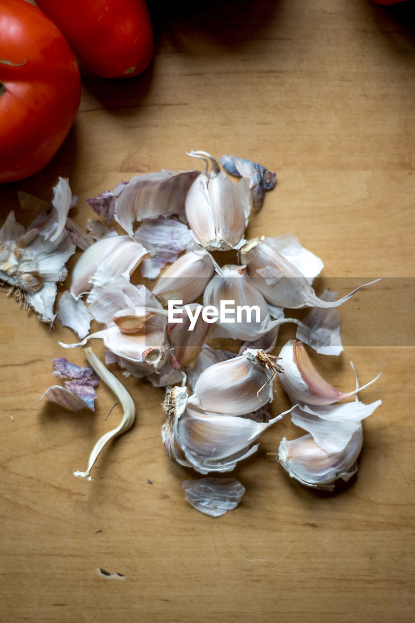 High angle view of garlic on wood