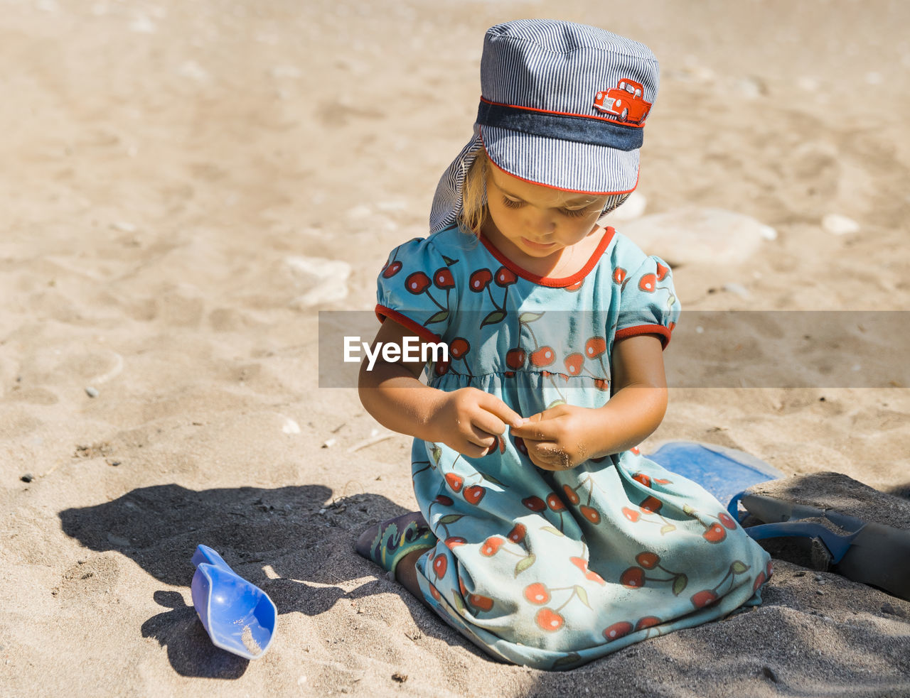 Full length of girl sitting on beach