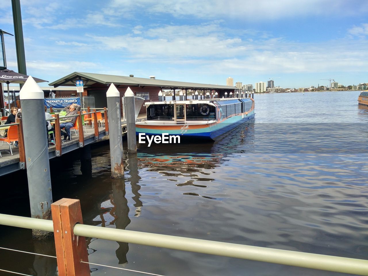 BOAT MOORED IN WATER