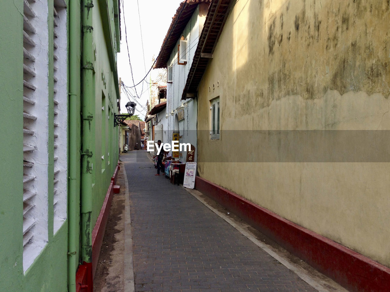NARROW STREET AMIDST BUILDINGS