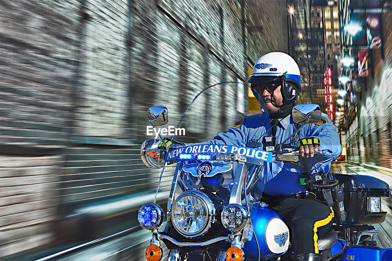 Man riding motorcycle in city