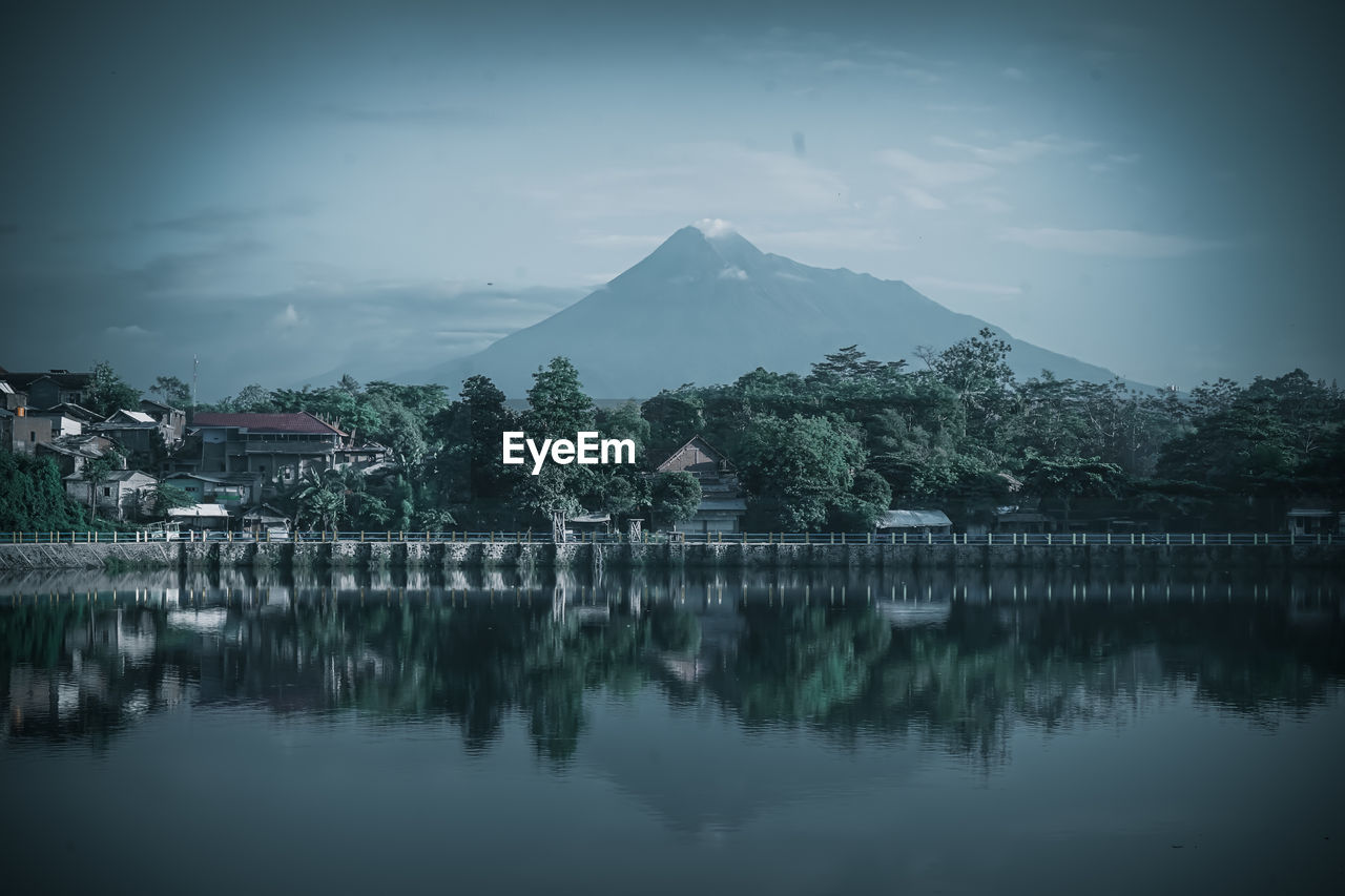 Scenic view of lake by trees against sky in tambak boyo yogyakarta indonesia