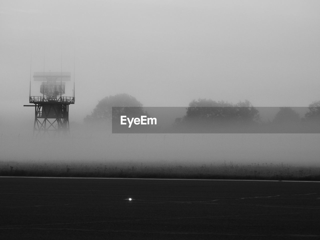 WIND TURBINES ON FIELD AGAINST SKY