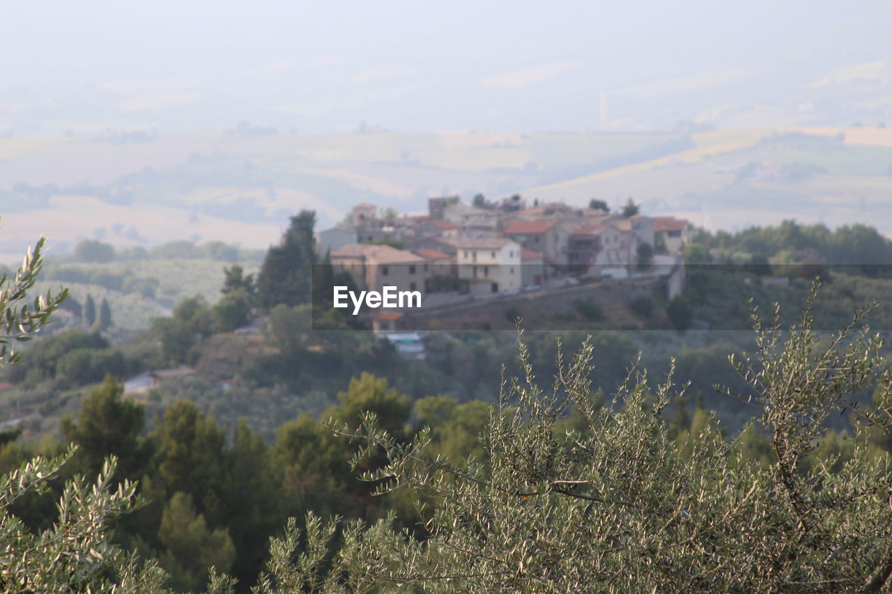 BUILT STRUCTURES ON LANDSCAPE AGAINST THE SKY