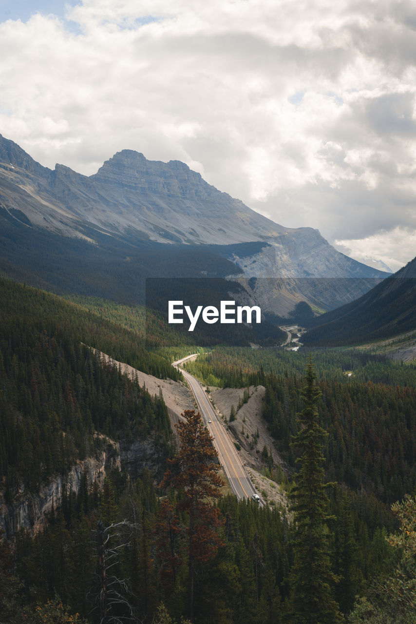 Scenic view of landscape and mountains against sky