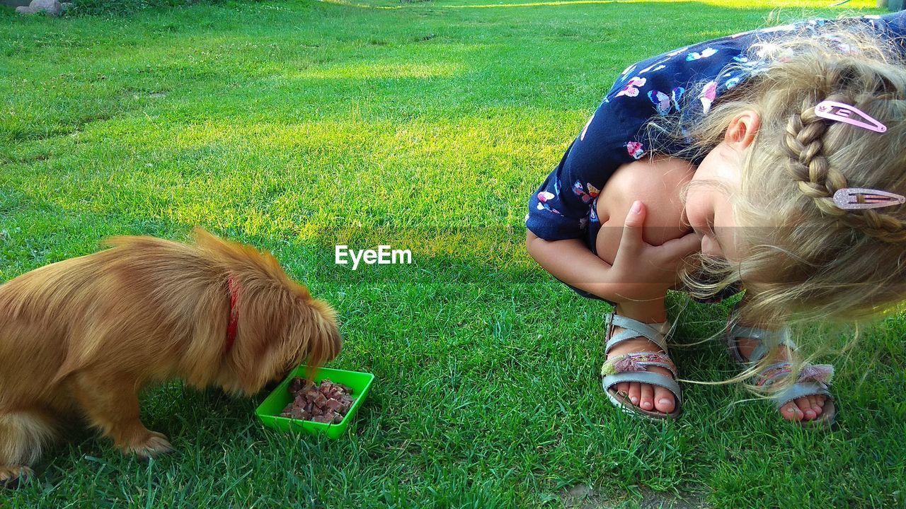 GIRL WITH DOG ON FIELD