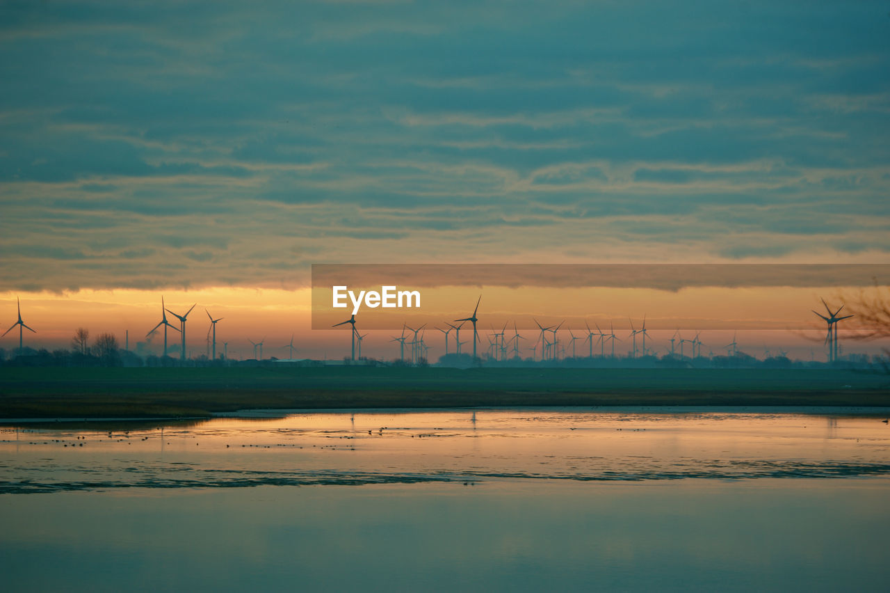 Scenic view of landscape against sky during sunset