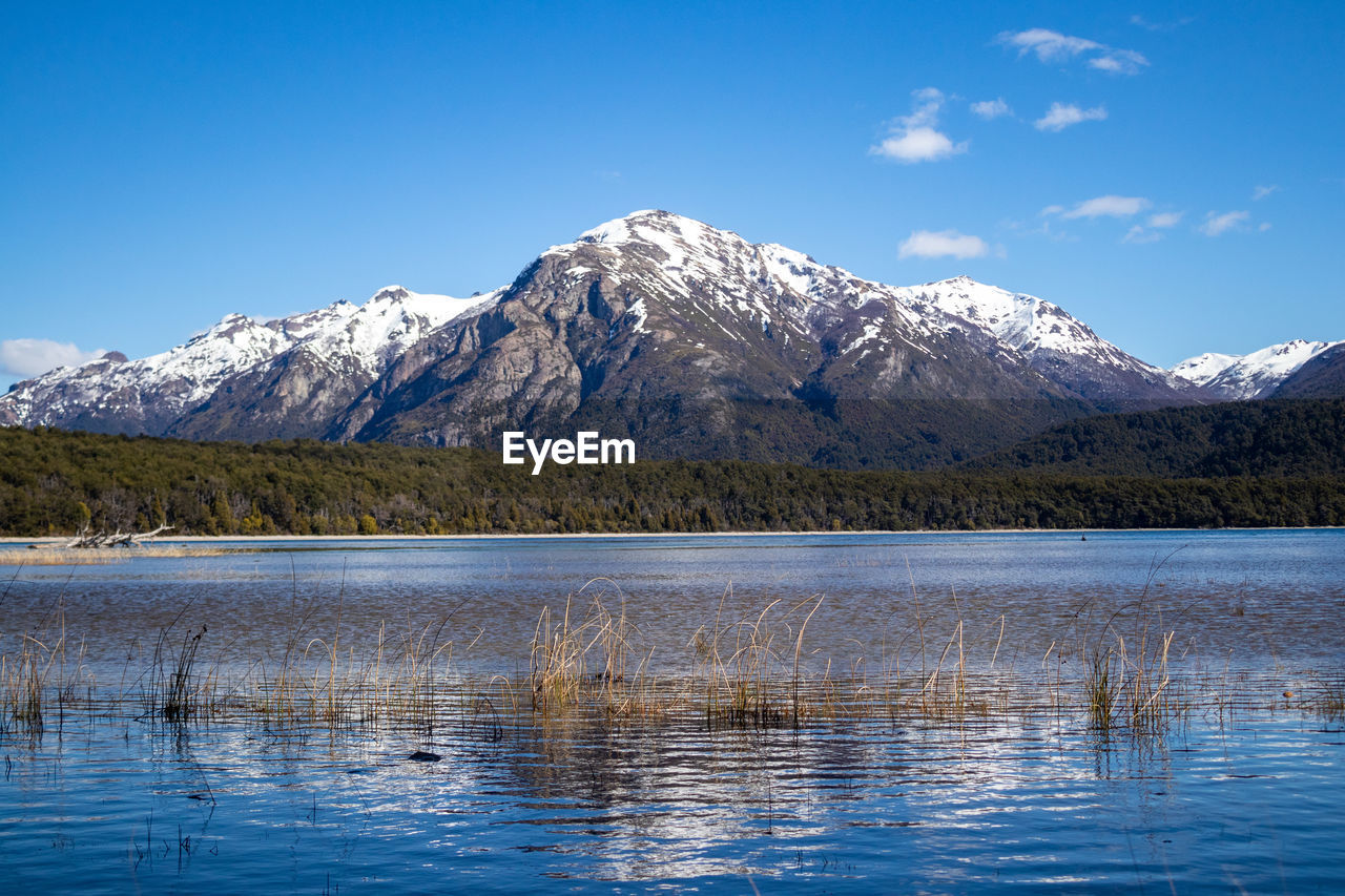 scenic view of lake and snowcapped mountains against sky