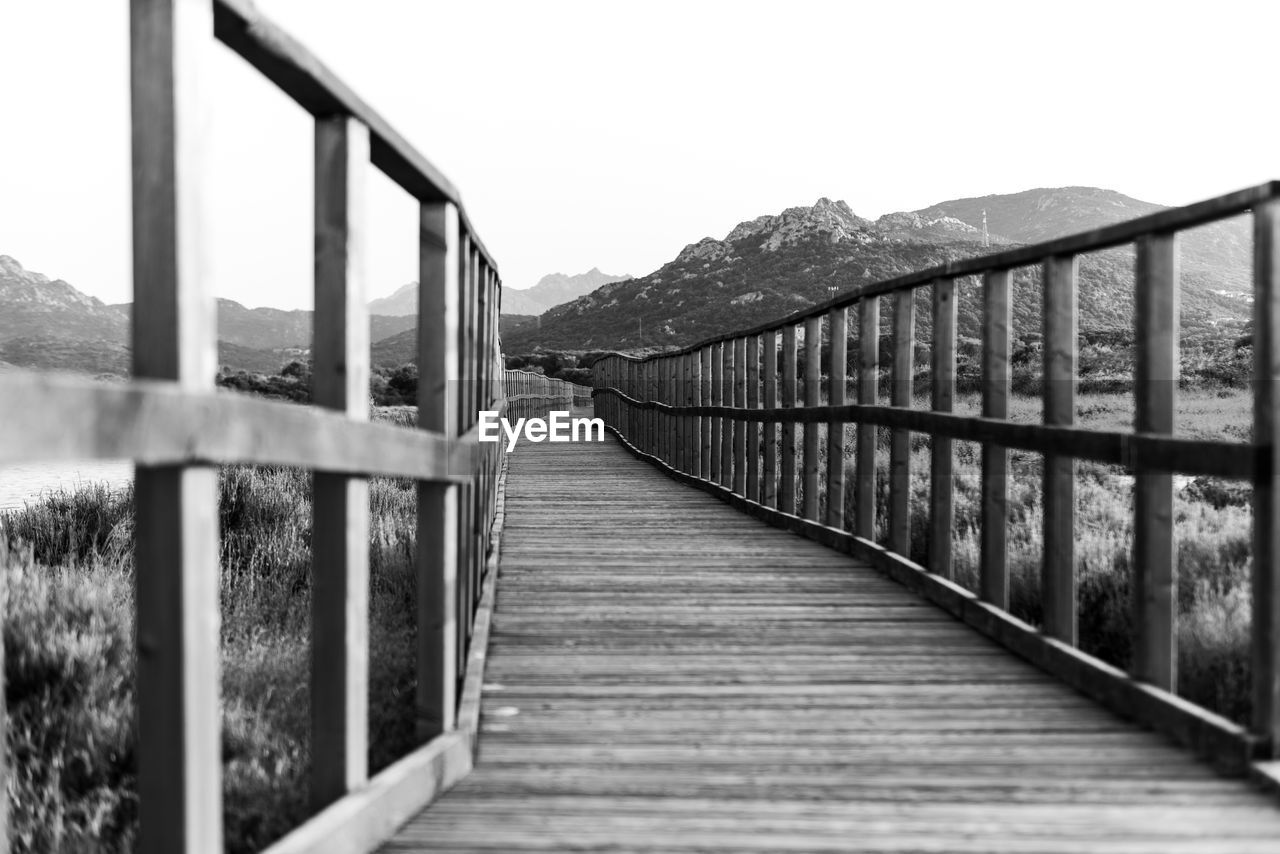 Footbridge leading towards mountains