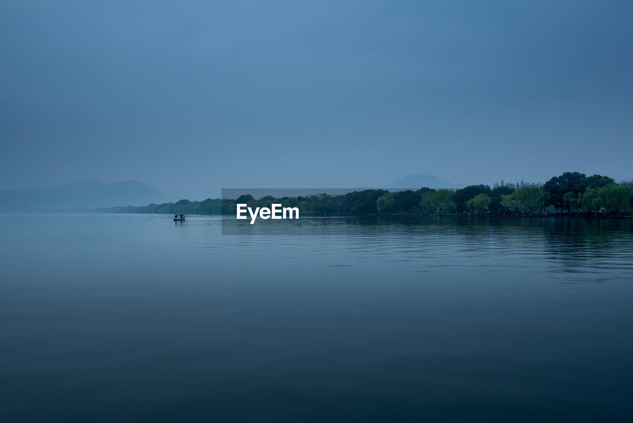 Scenic view of lake against clear sky