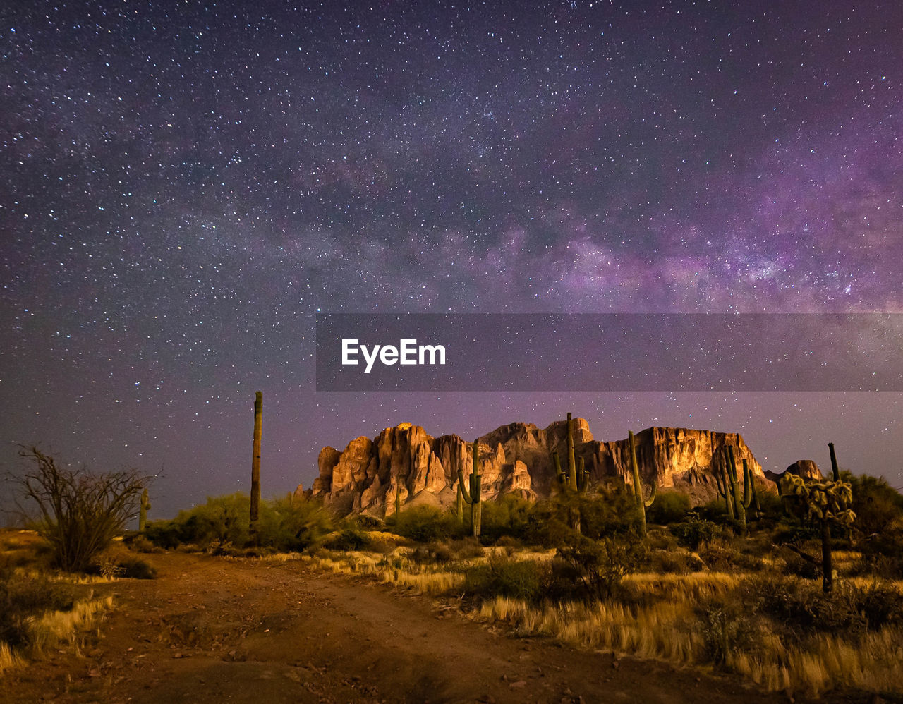 Scenic view of rock formation against sky at night