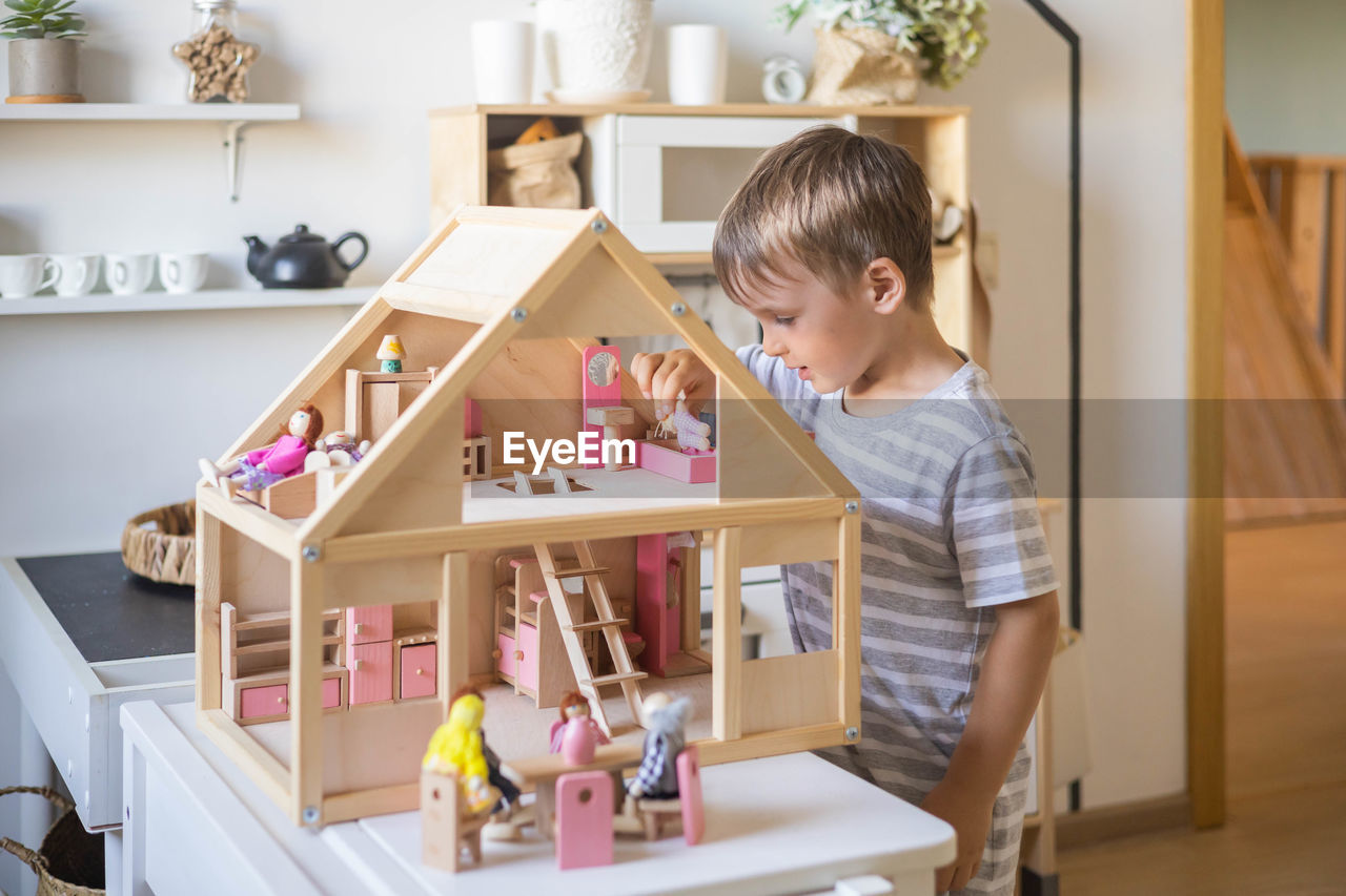 portrait of cute girl playing with toy blocks