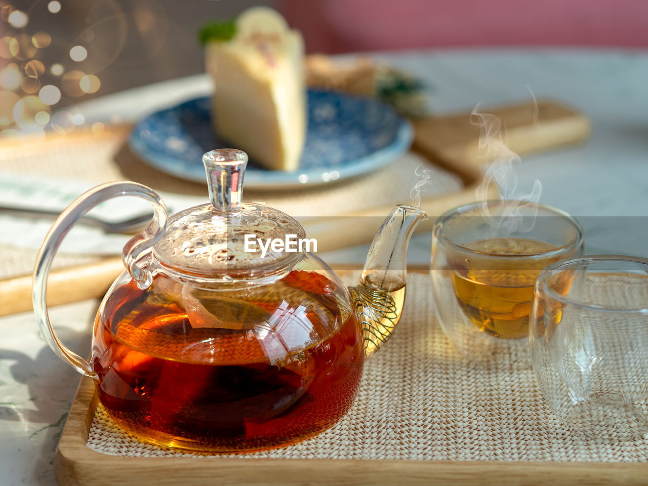 Afternoon tea in cups with teapot, teatime concepts.