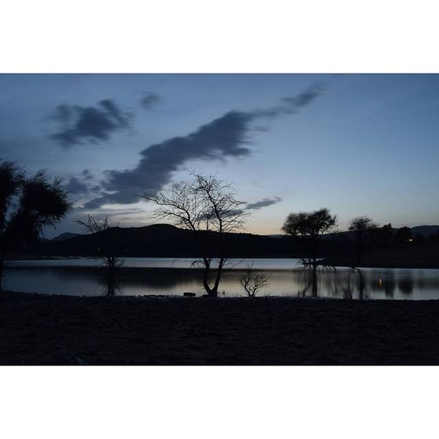 SCENIC VIEW OF RIVER AGAINST SKY AT SUNSET