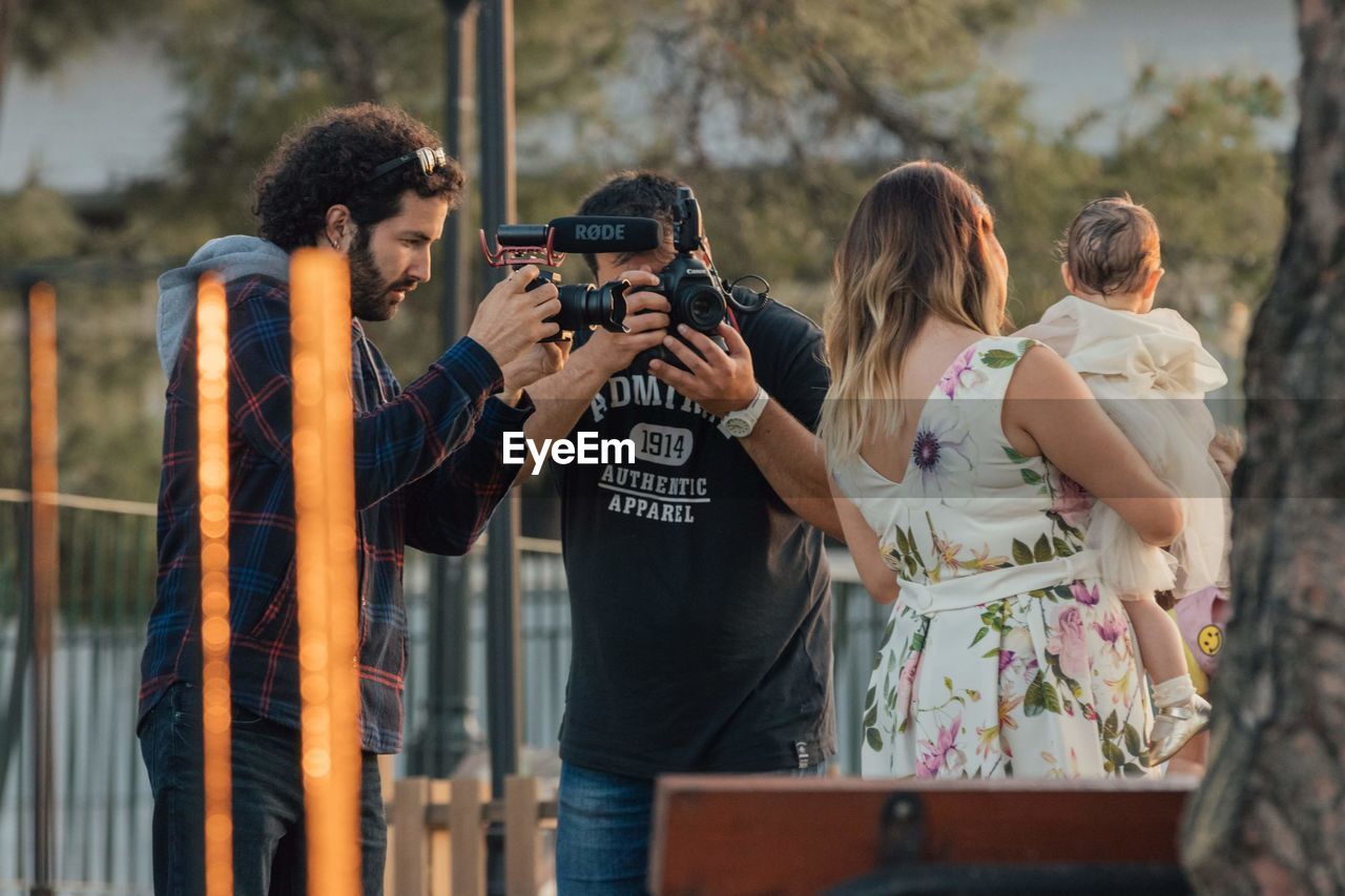 GROUP OF PEOPLE PHOTOGRAPHING