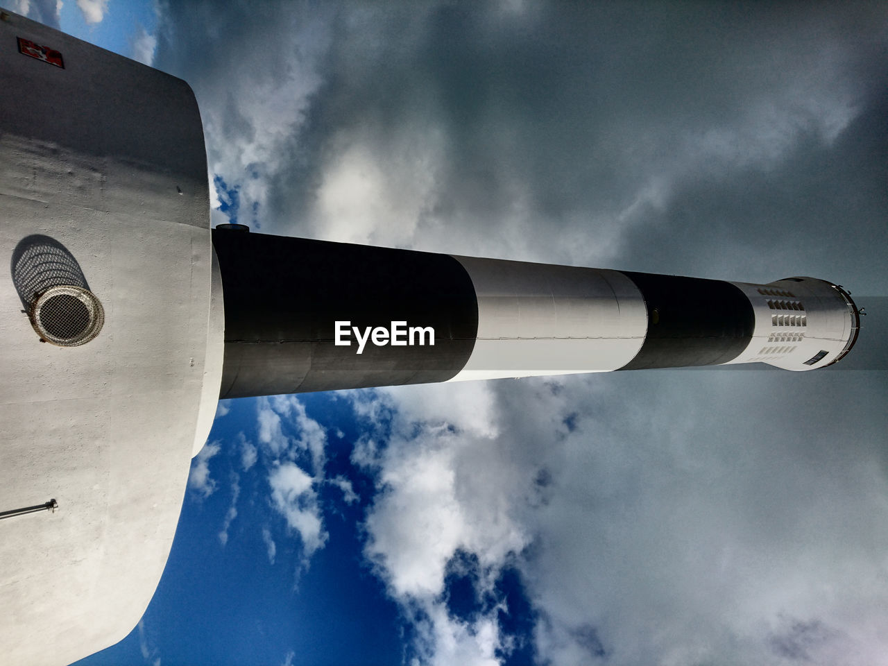 LOW ANGLE VIEW OF TOWER AND CLOUDY SKY