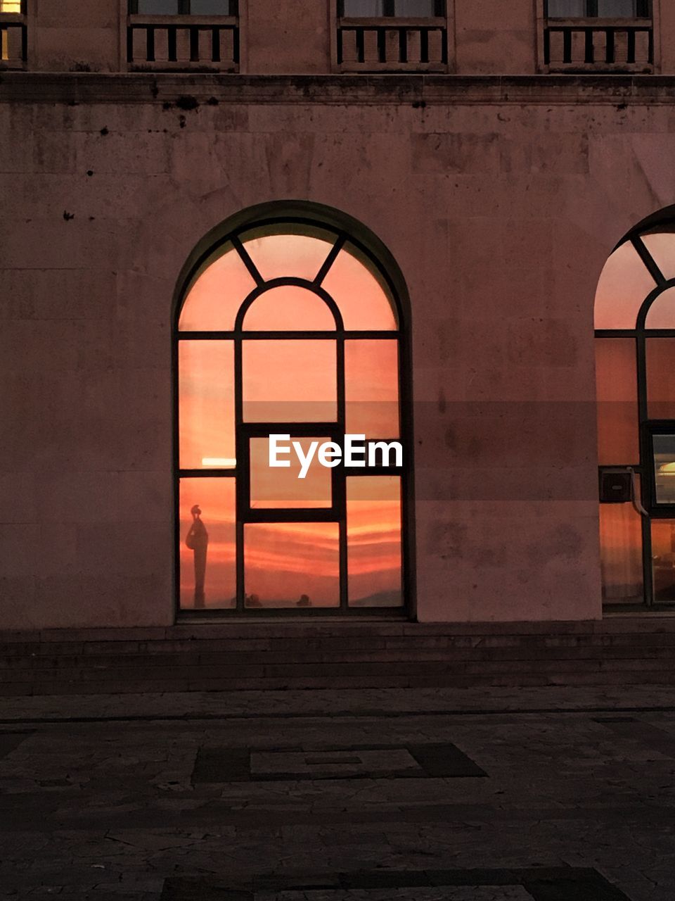 BUILDING SEEN THROUGH WINDOW