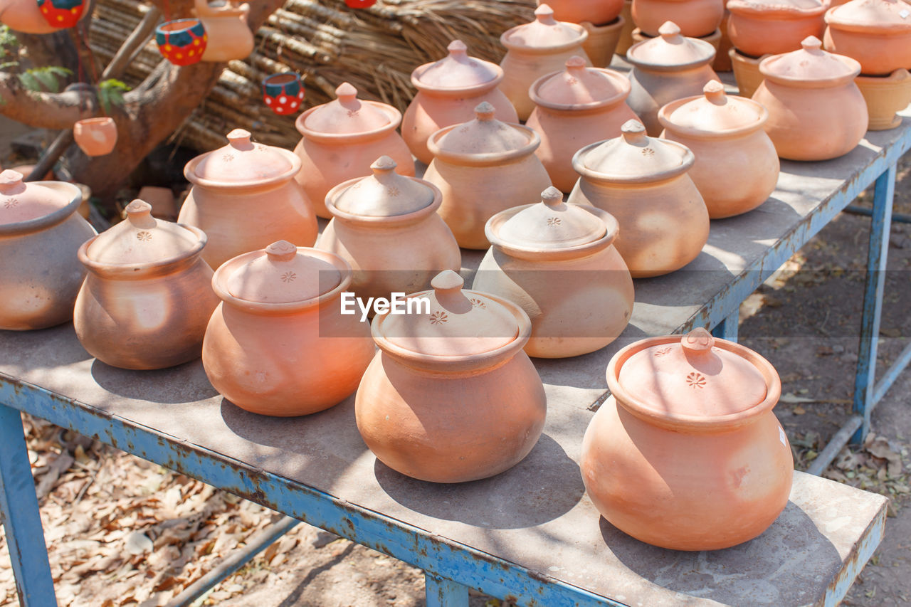 HIGH ANGLE VIEW OF VARIOUS CONTAINERS IN MARKET