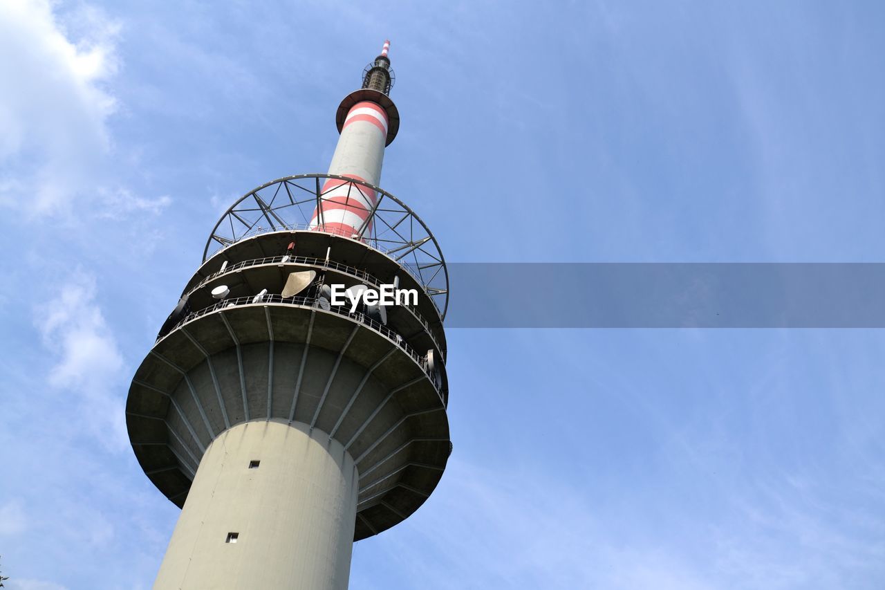 LOW ANGLE VIEW OF LIGHTHOUSE AGAINST BUILDING